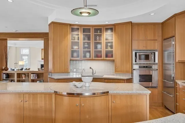 a kitchen with a appliances and cabinets