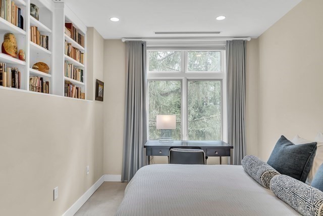 120 Seaver Street, Unit C102 Brookline, MA 02445 - Photo 18 of 30 a living room with furniture and large window