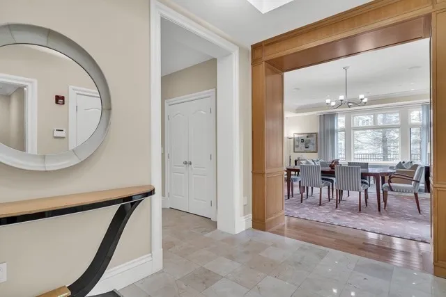 a view of a dining room with furniture and a mirror
