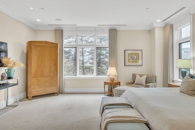 120 Seaver Street, Unit C102 Brookline, MA 02445 - Photo 22 of 30 a bedroom with bed and a large window
