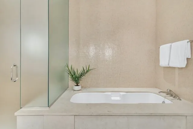 a bathroom with a bathtub and sink