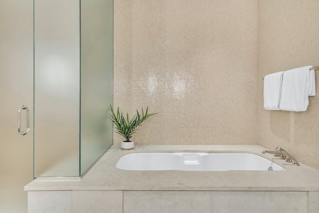 120 Seaver Street, Unit C102 Brookline, MA 02445 - Photo 25 of 30 a bathroom with a bathtub and sink