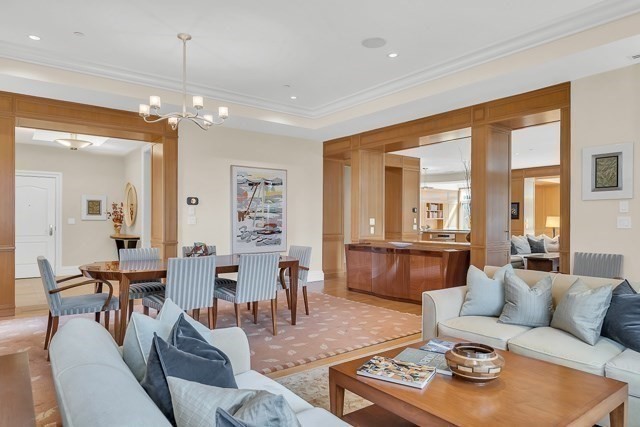 120 Seaver Street, Unit C102 Brookline, MA 02445 - Photo 7 of 30 a living room with furniture and a chandelier