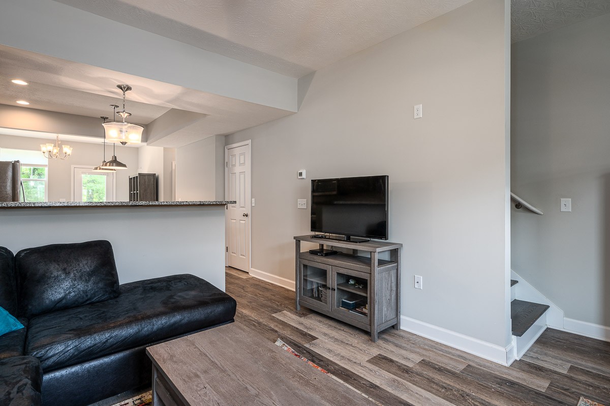 1382 Rural Hill Road, Unit 310 Antioch, TN 37013 - Photo 2 of 12 a living room with furniture and a flat screen tv