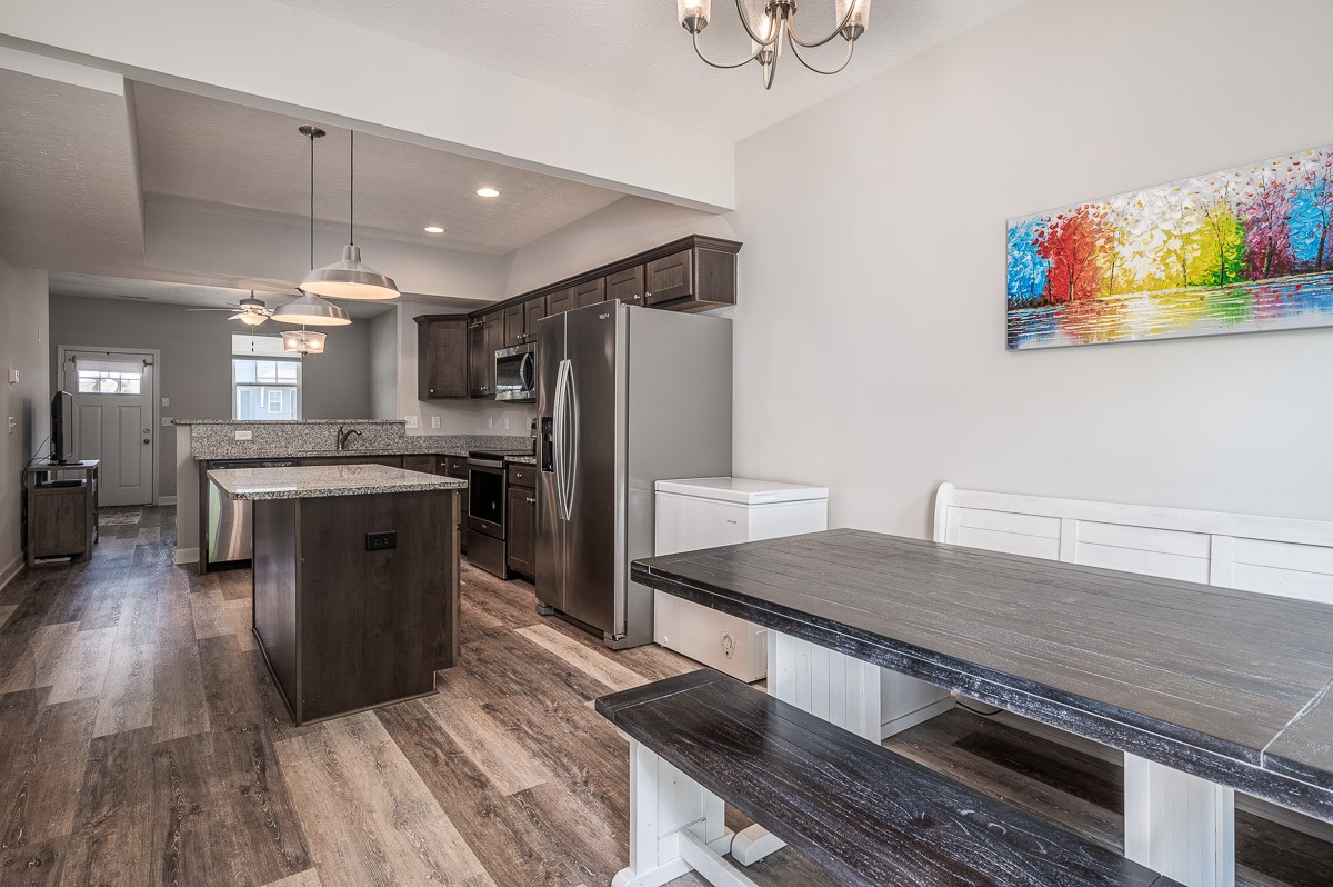 1382 Rural Hill Road, Unit 310 Antioch, TN 37013 - Photo 5 of 12 a kitchen with stainless steel appliances granite countertop a refrigerator a stove and a wooden floors