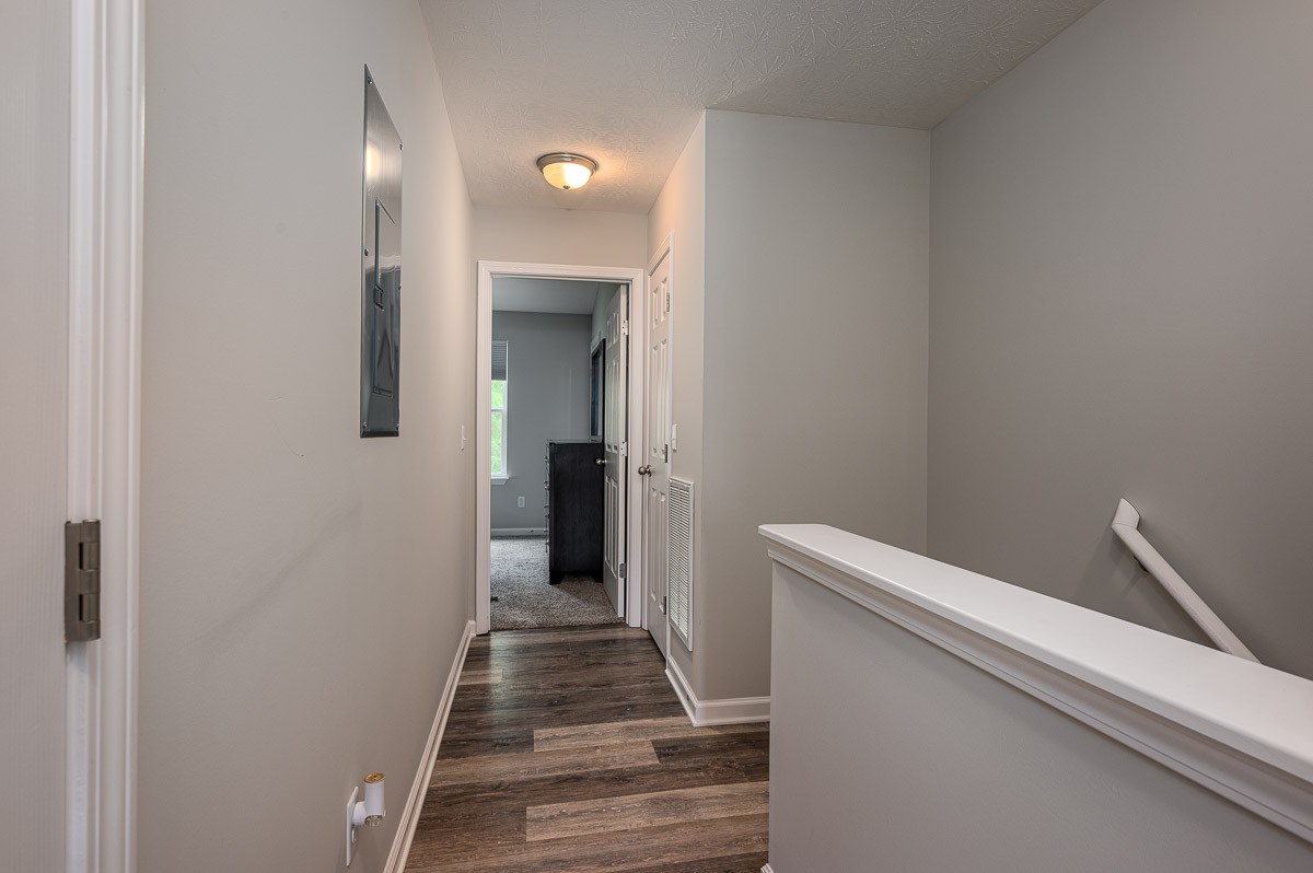 1382 Rural Hill Road, Unit 310 Antioch, TN 37013 - Photo 6 of 12 a view of a hallway with wooden floor and staircase