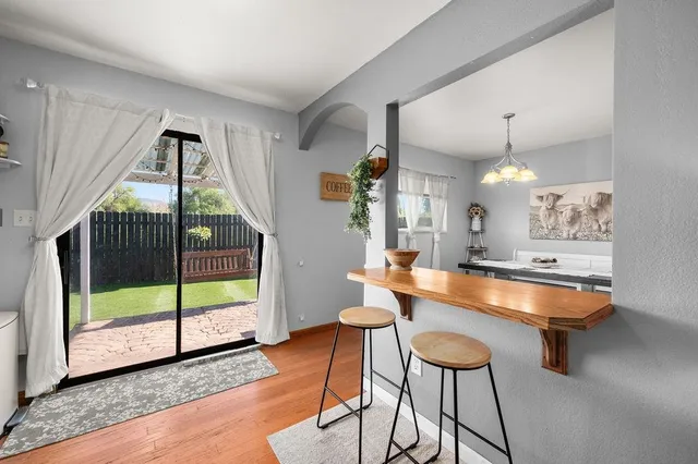 a view of a swimming pool with a patio and a garden