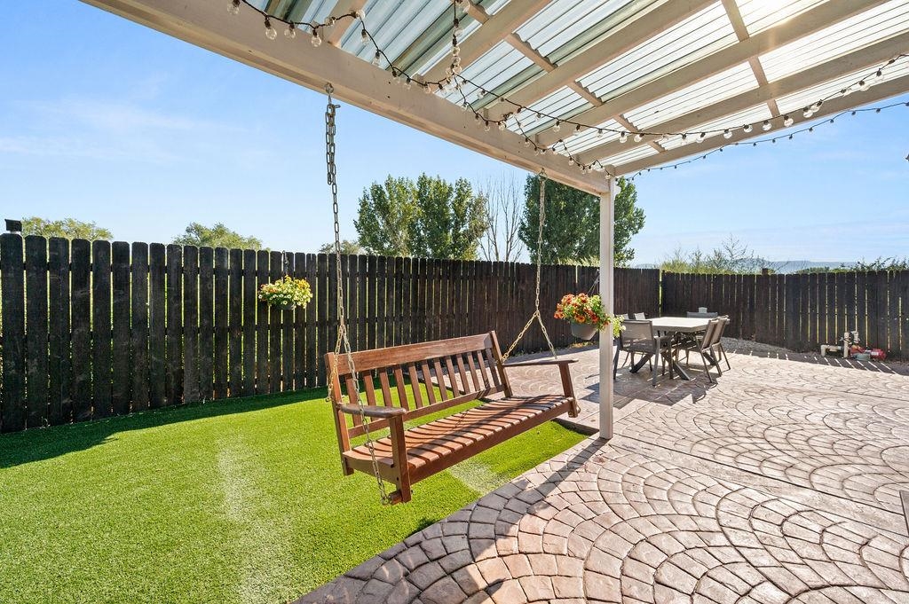 3022 Country Road Grand Junction, CO 81504 - Photo 20 of 23 a view of a swimming pool with a patio and a garden