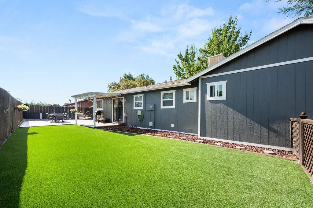 3022 Country Road Grand Junction, CO 81504 - Photo 22 of 23 a view of a house with a yard and sitting area