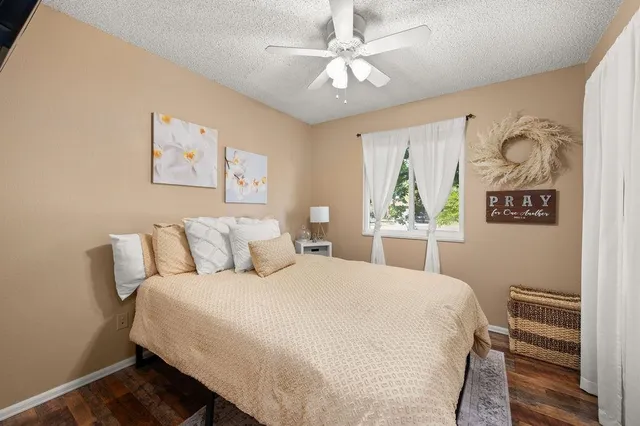 a bedroom with a large bed and a window