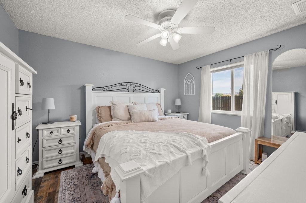 3022 Country Road Grand Junction, CO 81504 - Photo 10 of 23 a bedroom with a bed and a chandelier