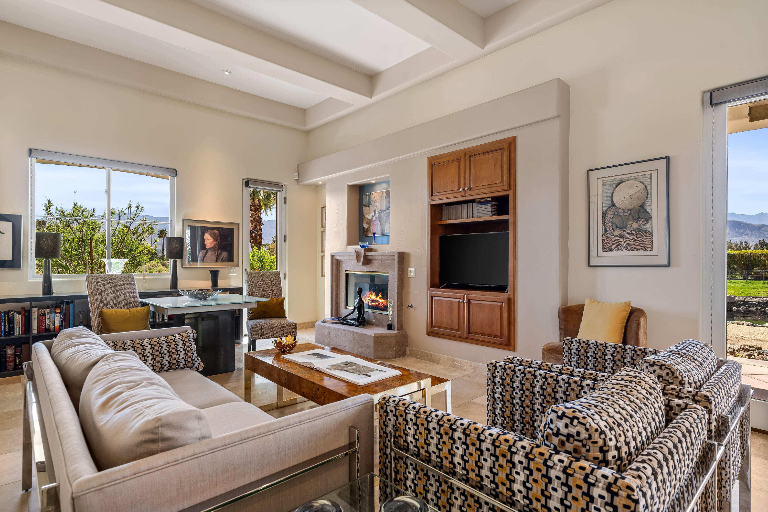 106 Piazza Perrone Palm Desert, CA 92260 - Photo 2 of 68 a living room with furniture and a flat screen tv