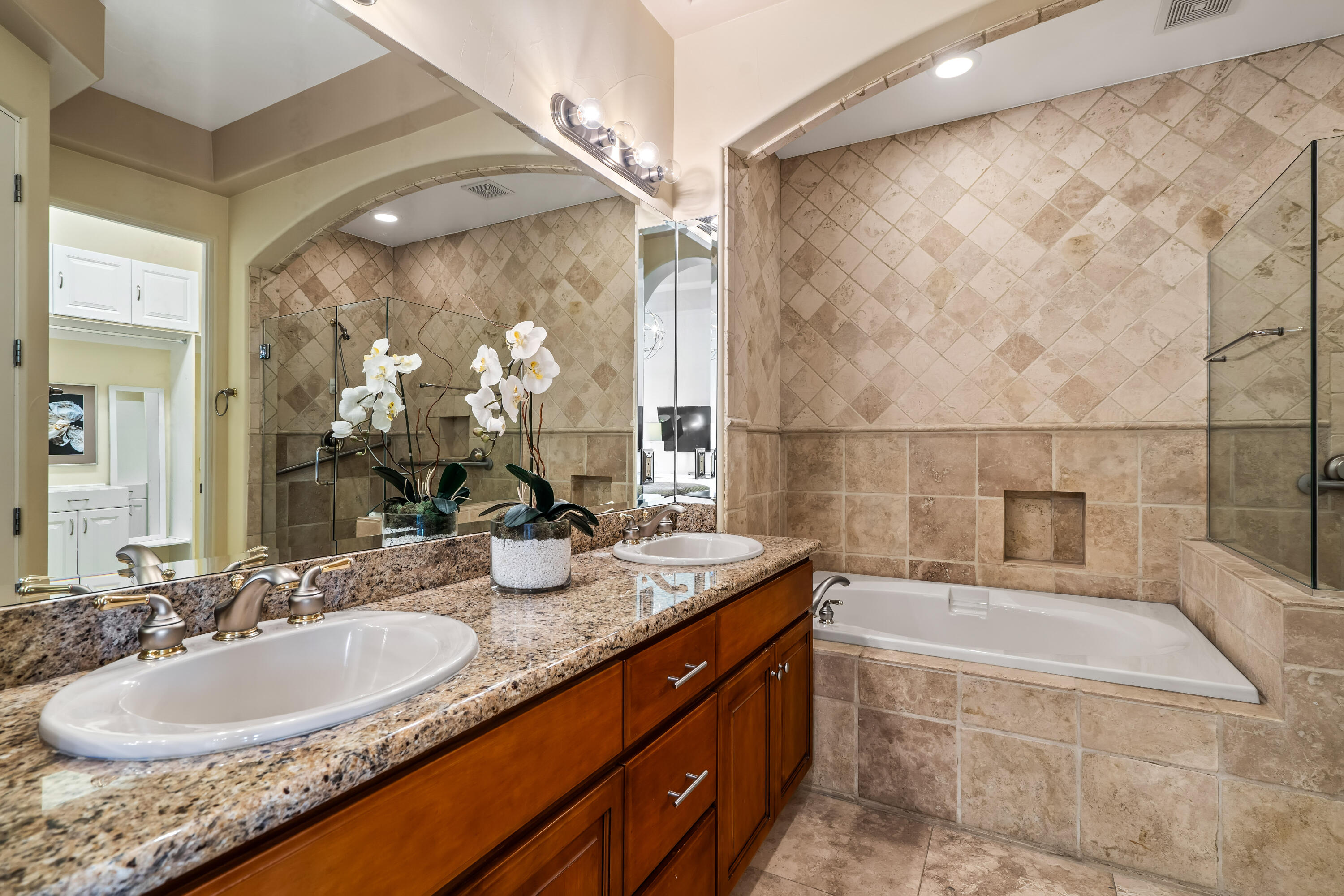 106 Piazza Perrone Palm Desert, CA 92260 - Photo 33 of 68 a bathroom with a granite countertop sink and a mirror