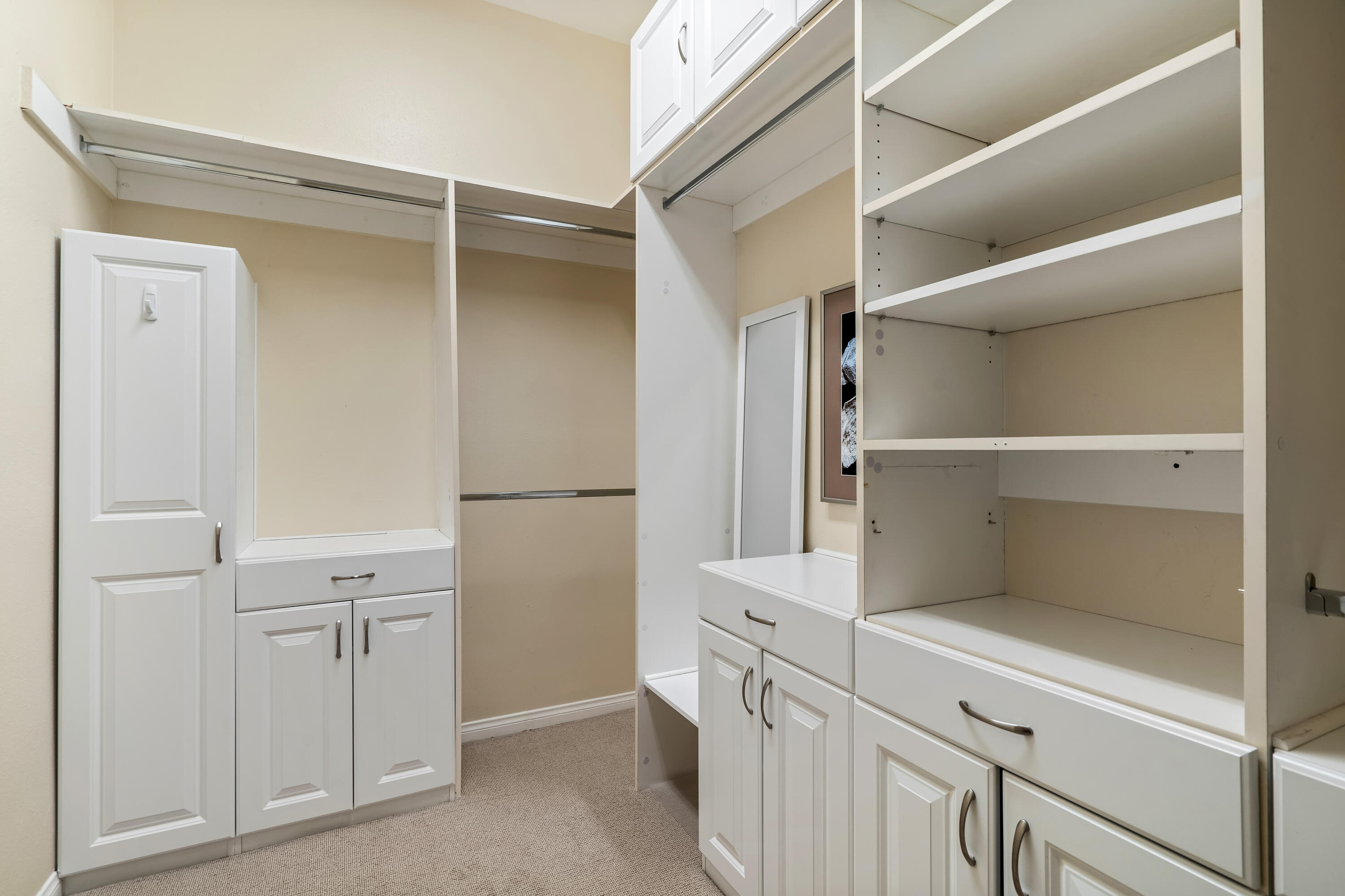 106 Piazza Perrone Palm Desert, CA 92260 - Photo 35 of 68 a kitchen with white cabinets and white appliances