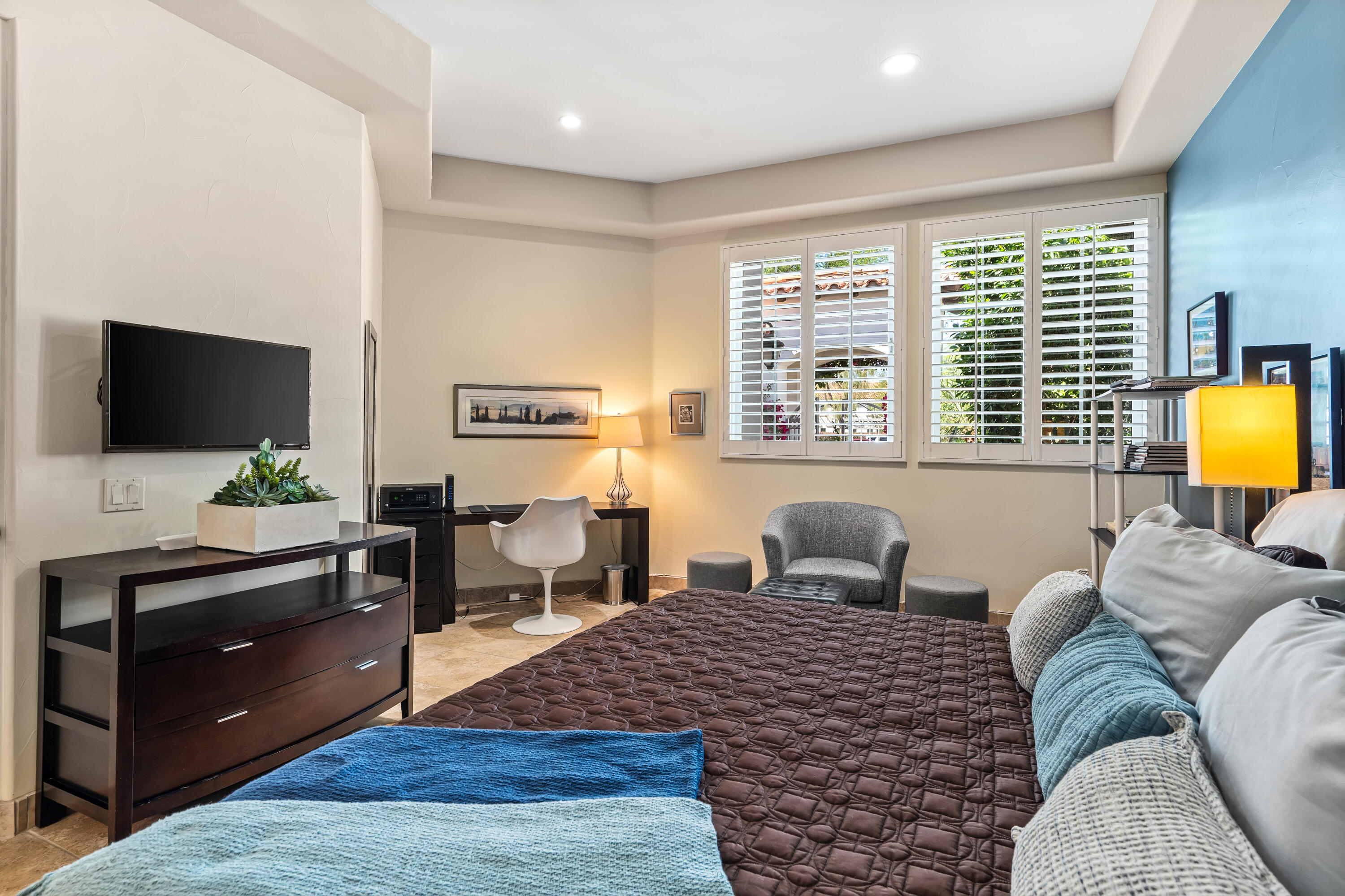 106 Piazza Perrone Palm Desert, CA 92260 - Photo 43 of 68 a bedroom with a bed window and a flat screen tv