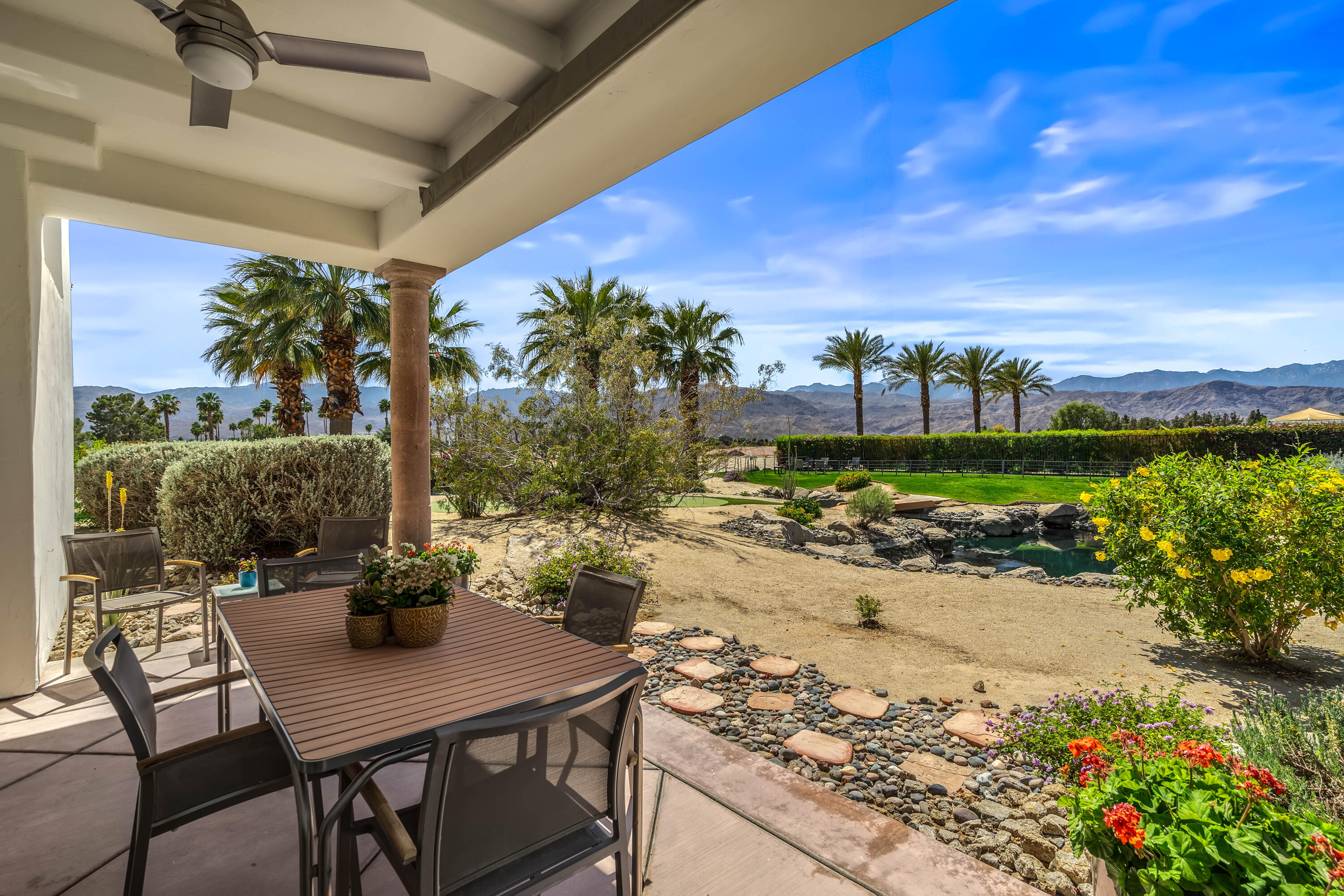 106 Piazza Perrone Palm Desert, CA 92260 - Photo 48 of 68 a view of a backyard with plants and a patio