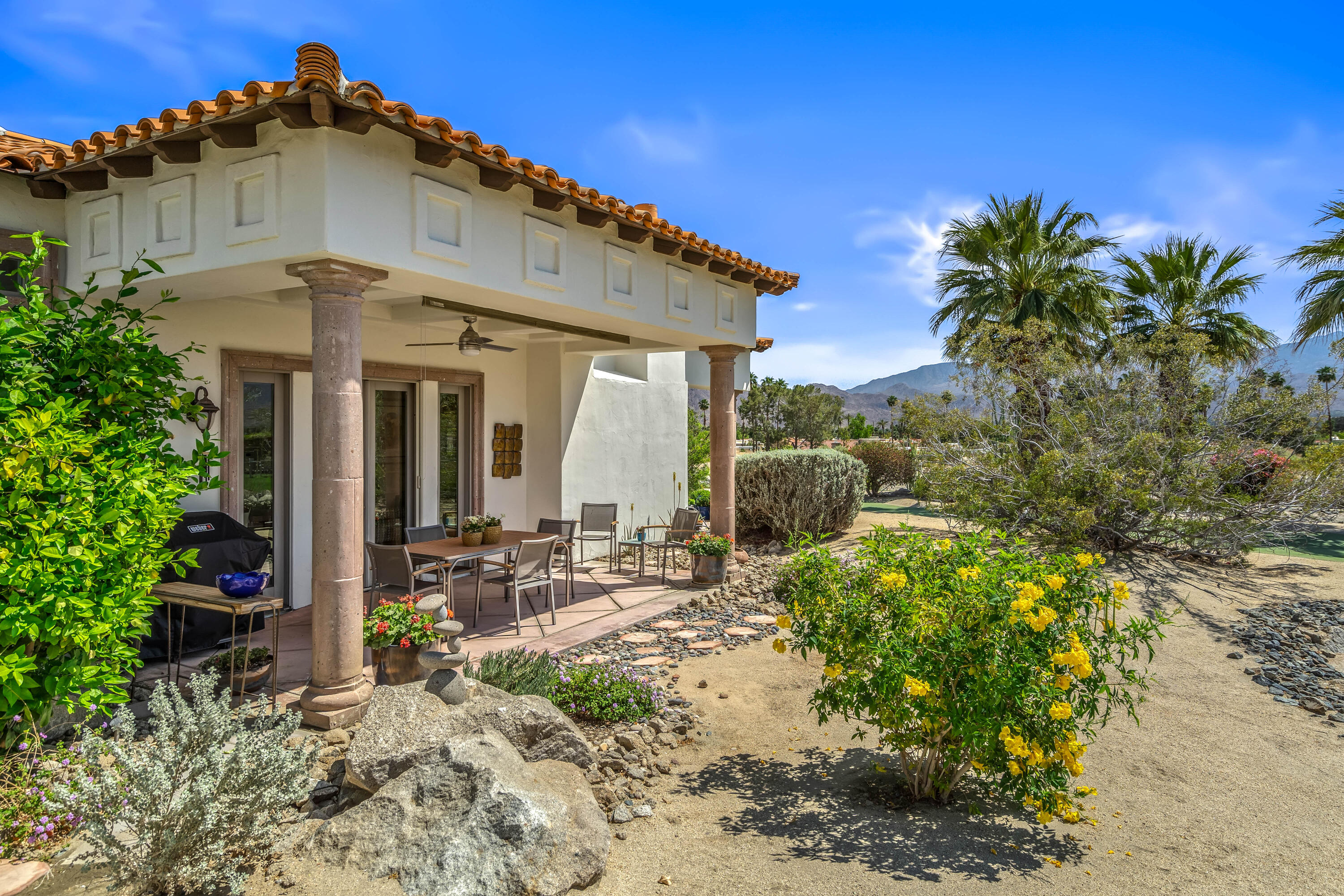 106 Piazza Perrone Palm Desert, CA 92260 - Photo 49 of 68 a front view of a house with a yard
