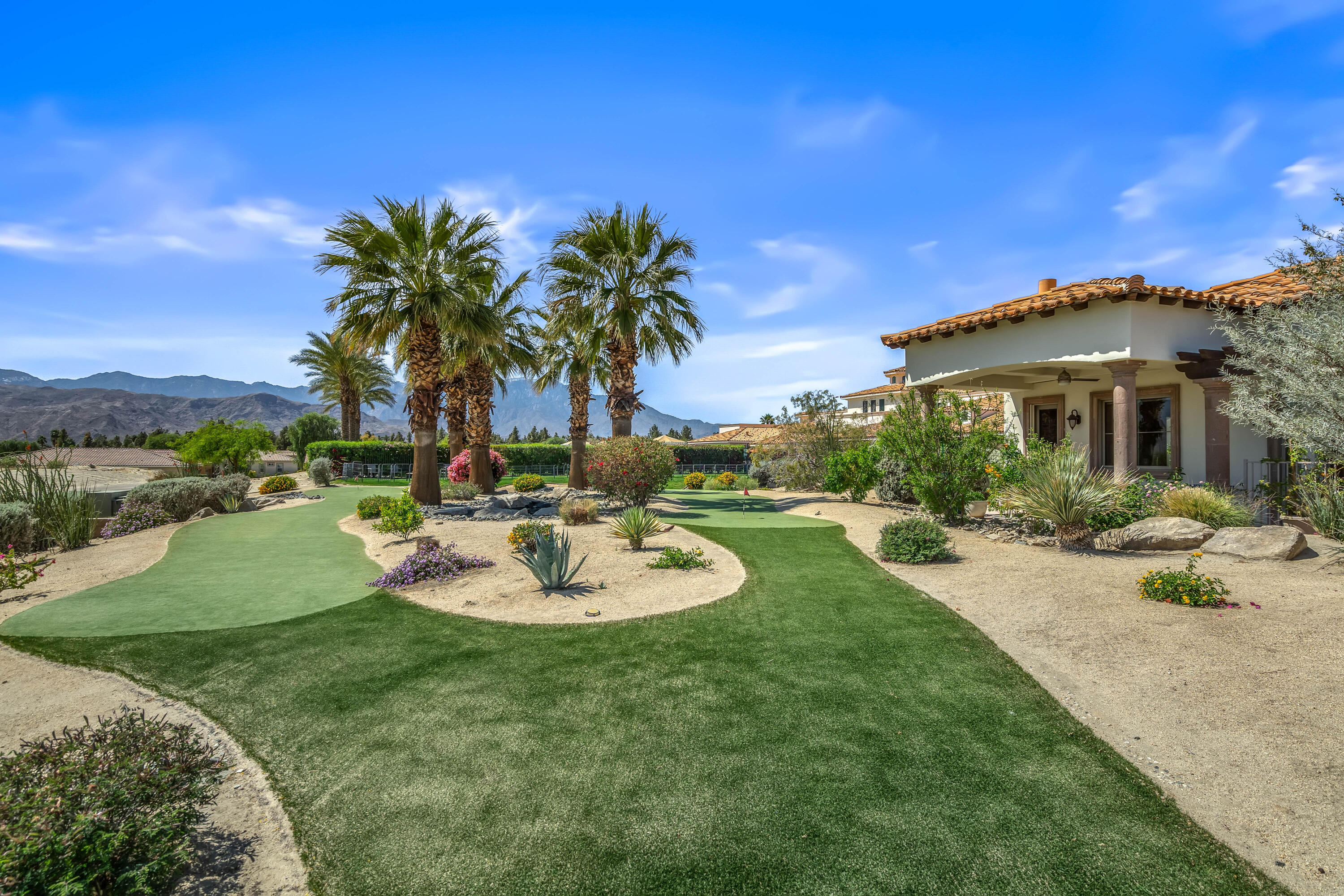 106 Piazza Perrone Palm Desert, CA 92260 - Photo 55 of 68 a view of a backyard with plants and a patio