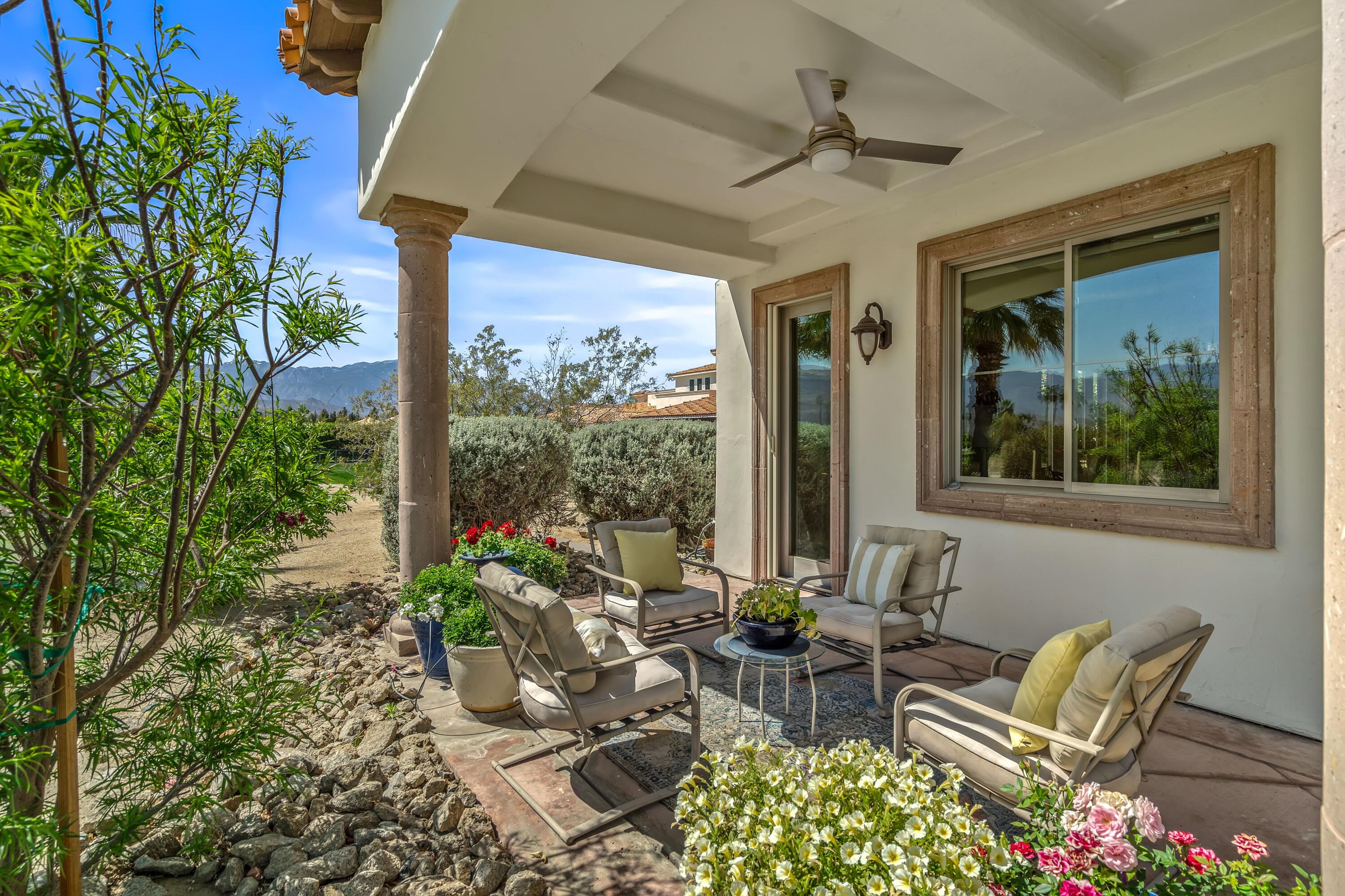 106 Piazza Perrone Palm Desert, CA 92260 - Photo 59 of 68 a view of a patio with table and chairs and potted plants