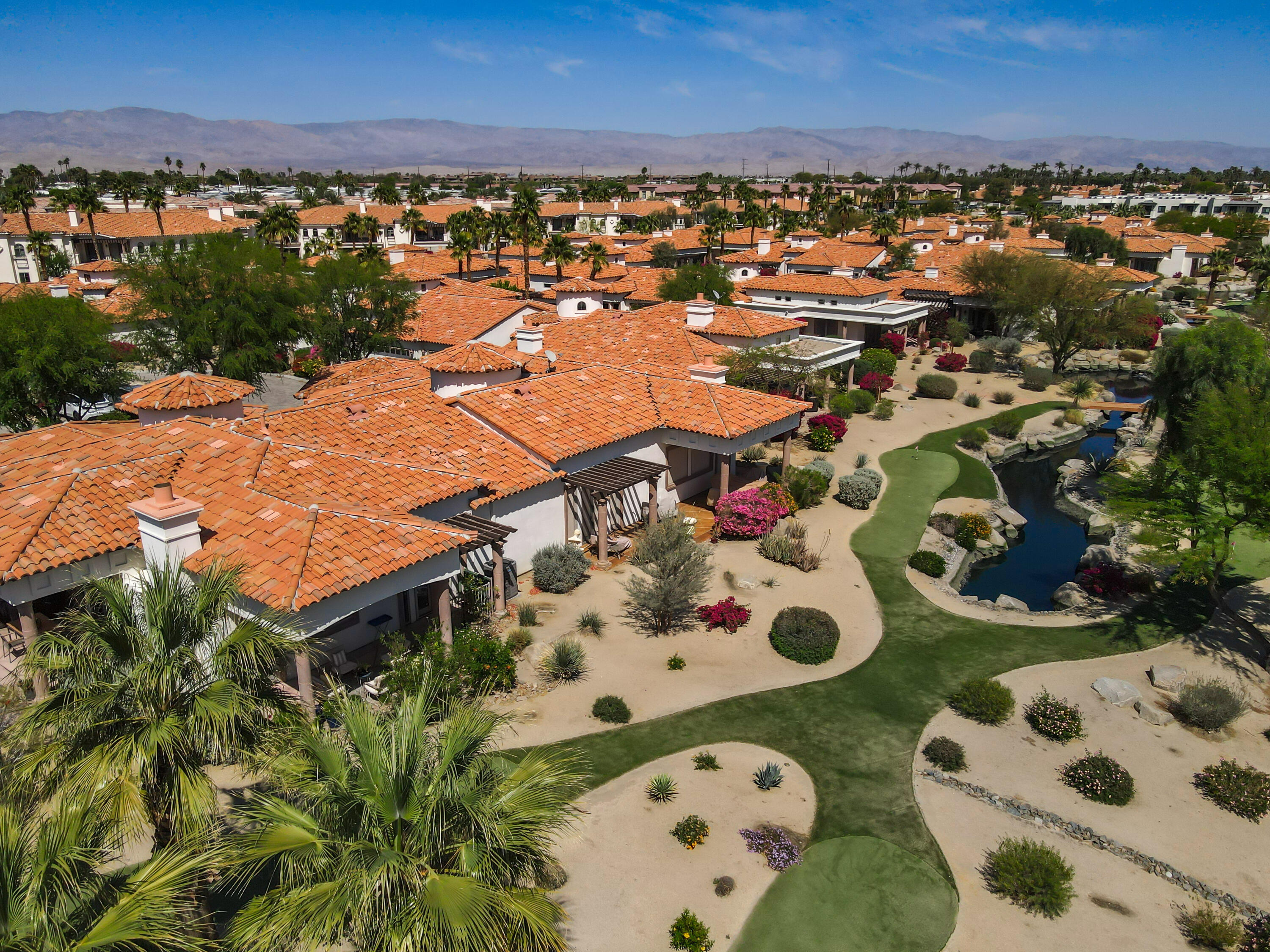 106 Piazza Perrone Palm Desert, CA 92260 - Photo 64 of 68 an aerial view of a house with a outdoor space