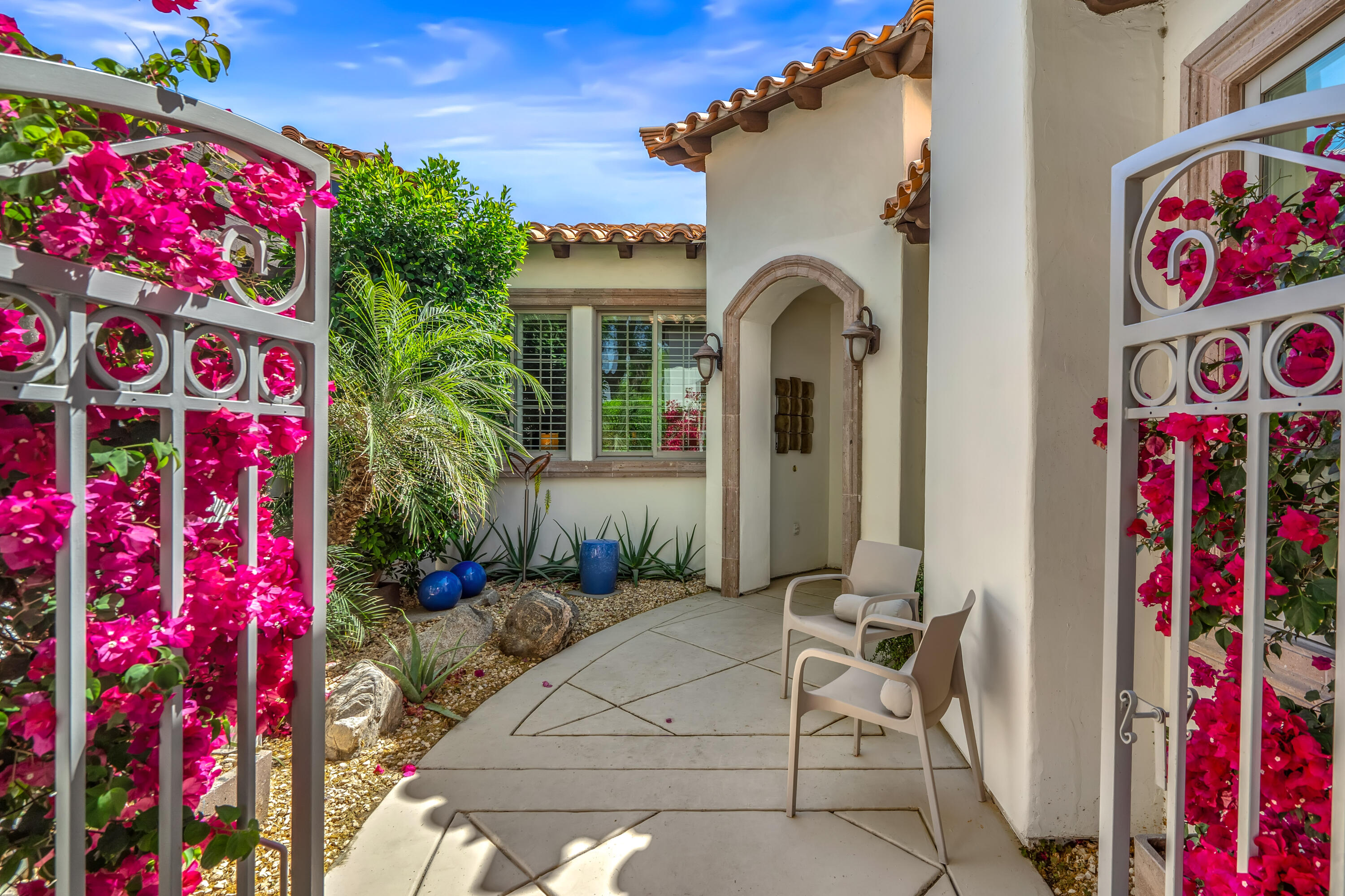 106 Piazza Perrone Palm Desert, CA 92260 - Photo 9 of 68 a front view of a house