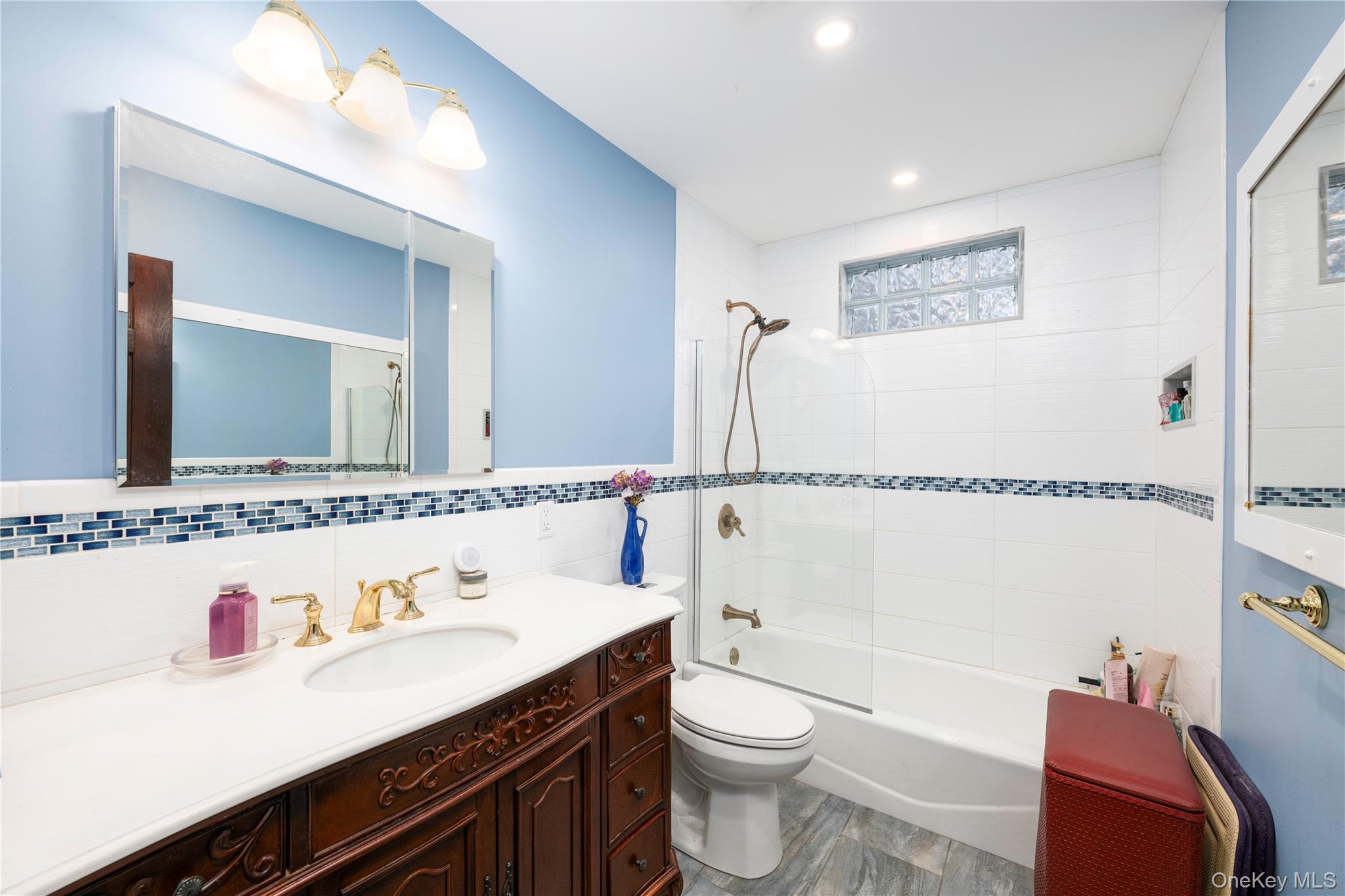 630 Union Valley Road Mahopac, NY 10541 - Photo 20 of 34 a bathroom with a sink a toilet a mirror and vanity