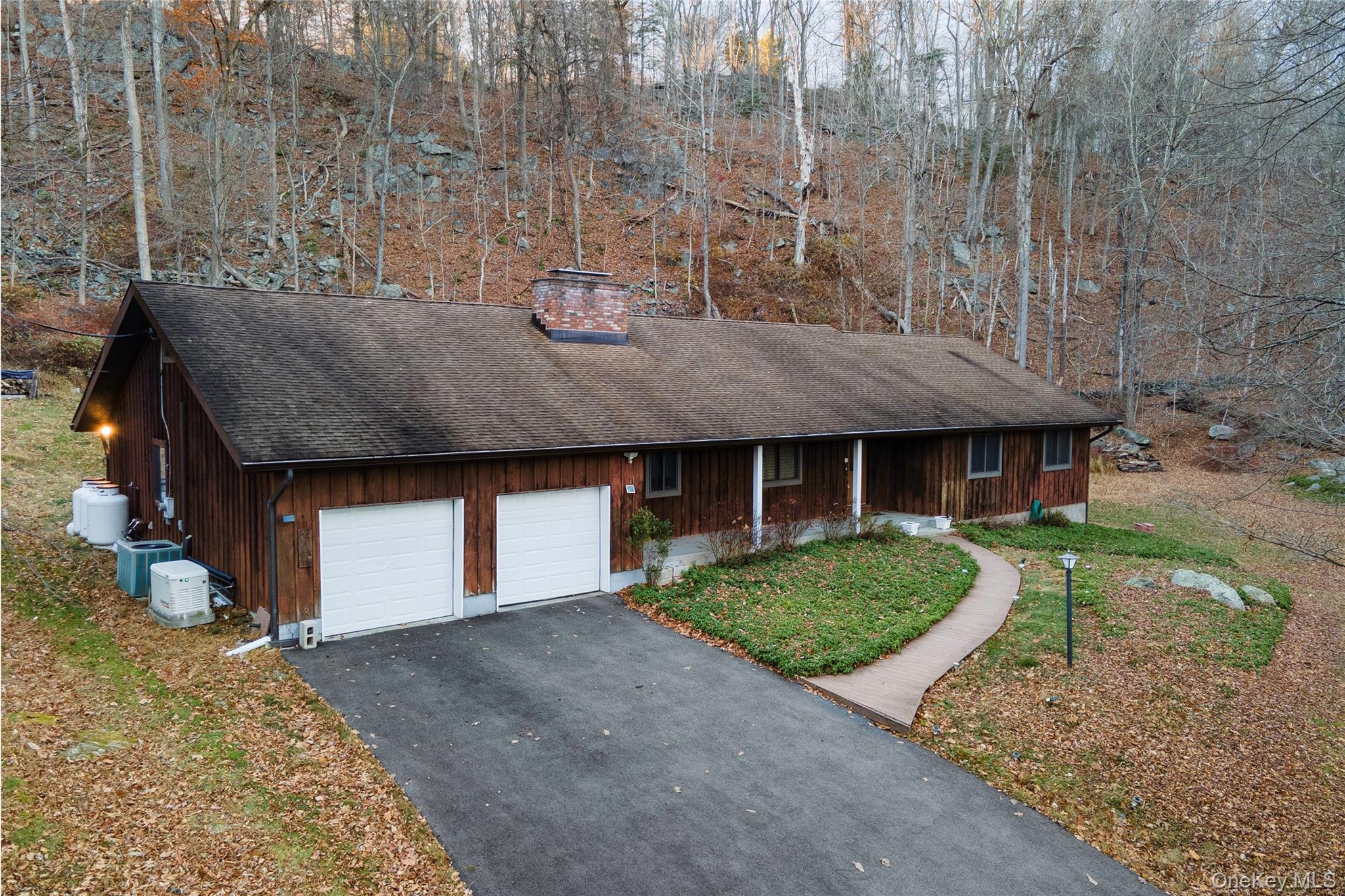630 Union Valley Road Mahopac, NY 10541 - Photo 2 of 34 a front view of a house with garden