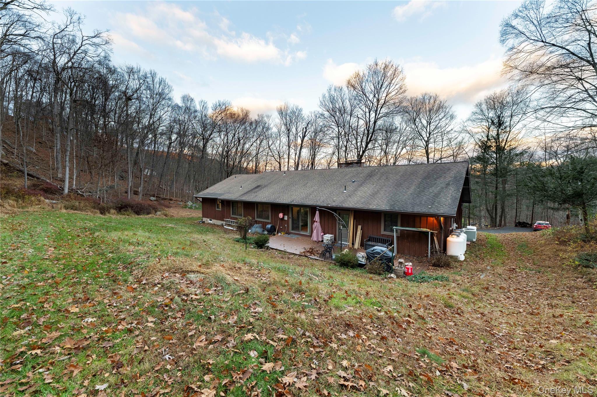630 Union Valley Road Mahopac, NY 10541 - Photo 25 of 34 a view of a house with backyard and trees