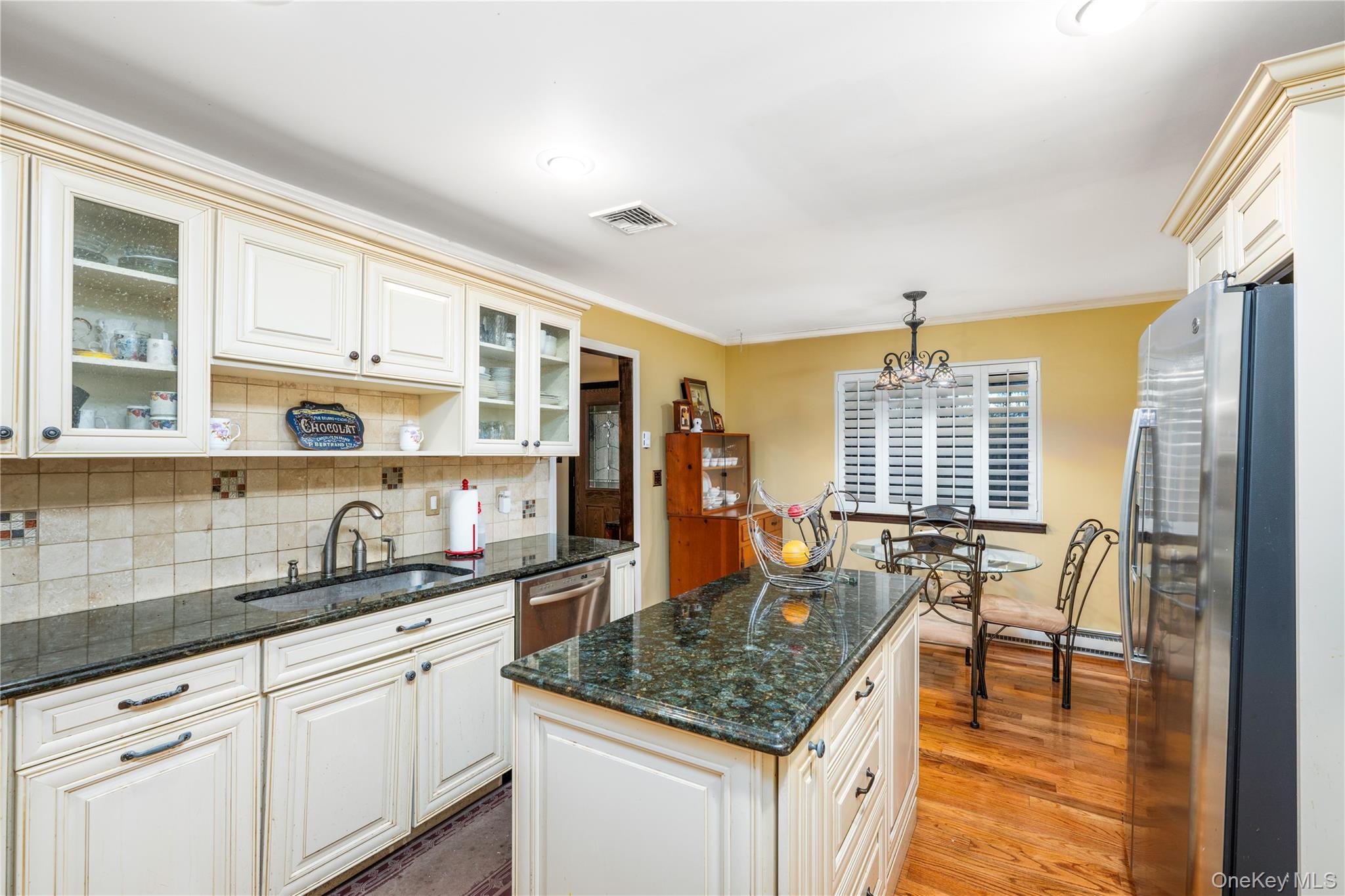 630 Union Valley Road Mahopac, NY 10541 - Photo 9 of 34 a kitchen with granite countertop a sink and cabinets