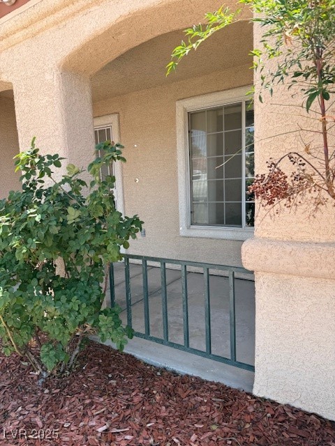951 Country Back Road Las Vegas, NV 89123 - Photo 3 of 20 View of exterior entry featuring stucco siding