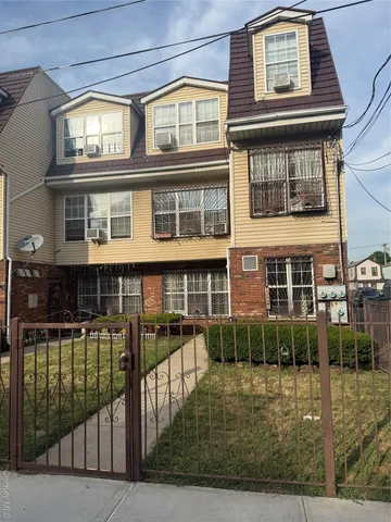 a view of a brick building with many windows