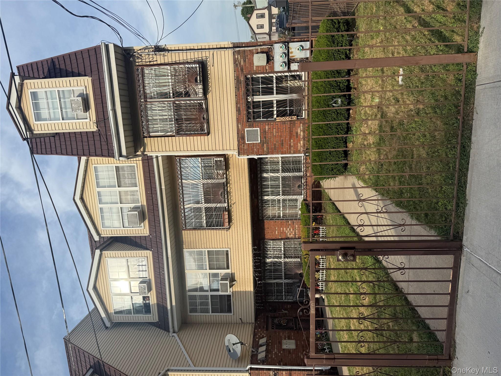 a view of a brick building with many windows