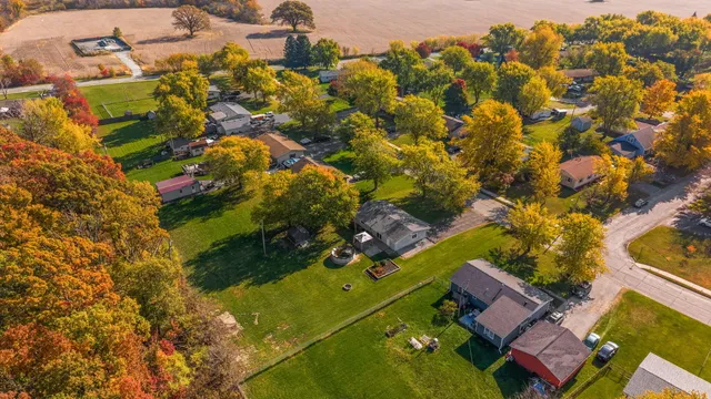 an aerial view of residential houses with outdoor space