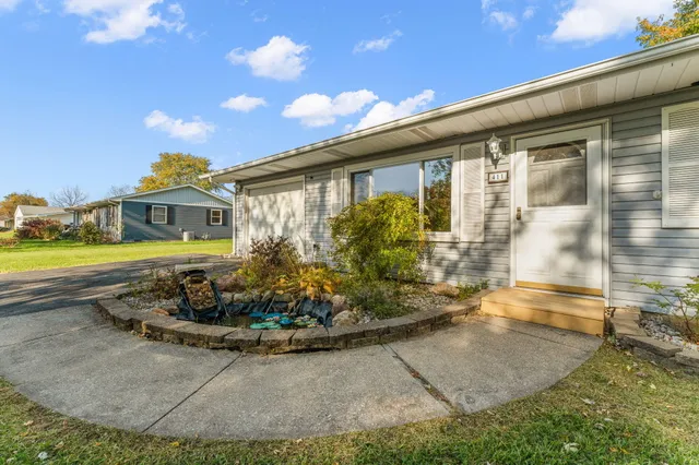 a front view of a house with garden
