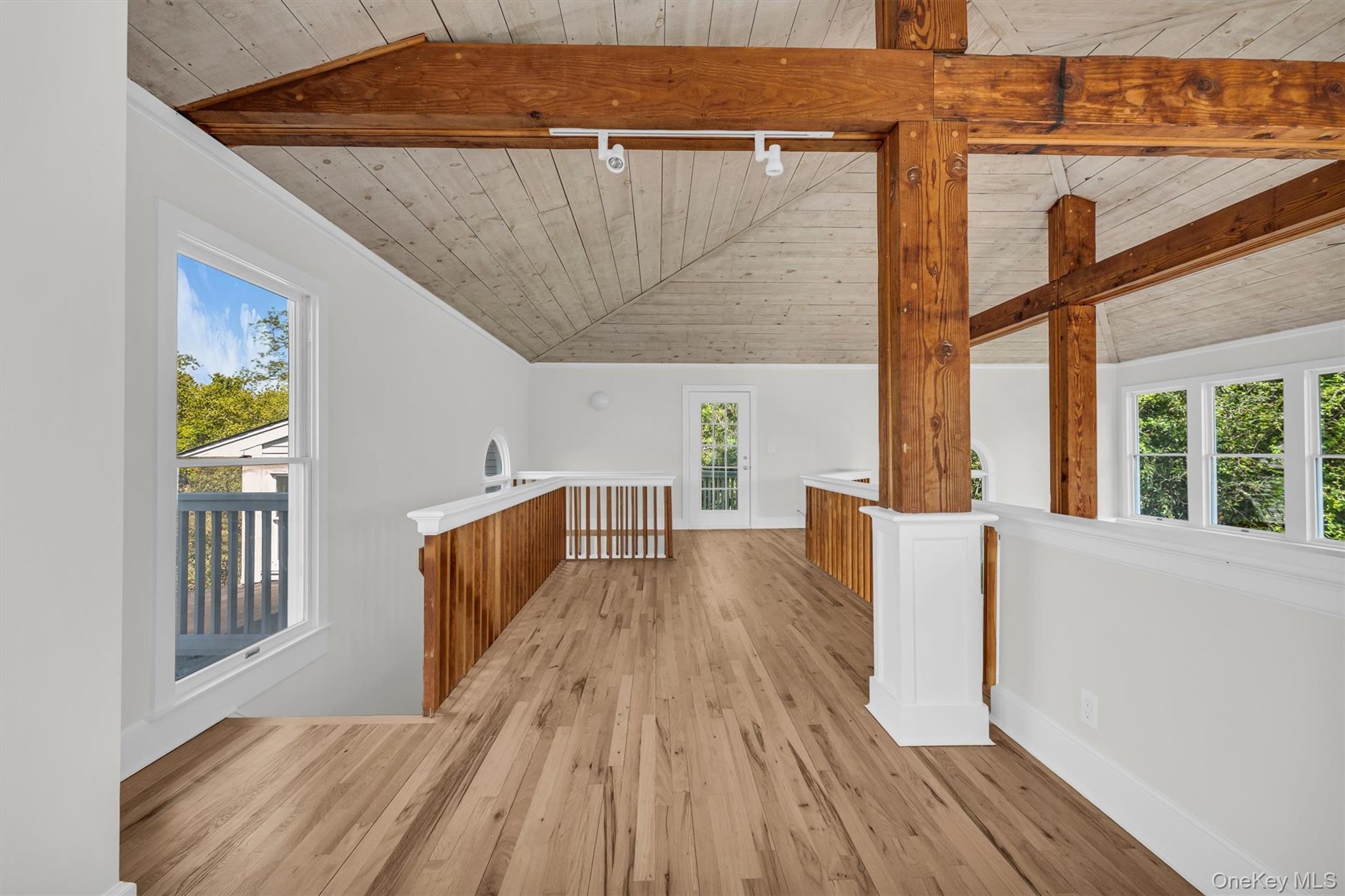 238 Beaver Dam Road Brookhaven, NY 11719 - Photo 24 of 44 a view of balcony with wooden floor and fence