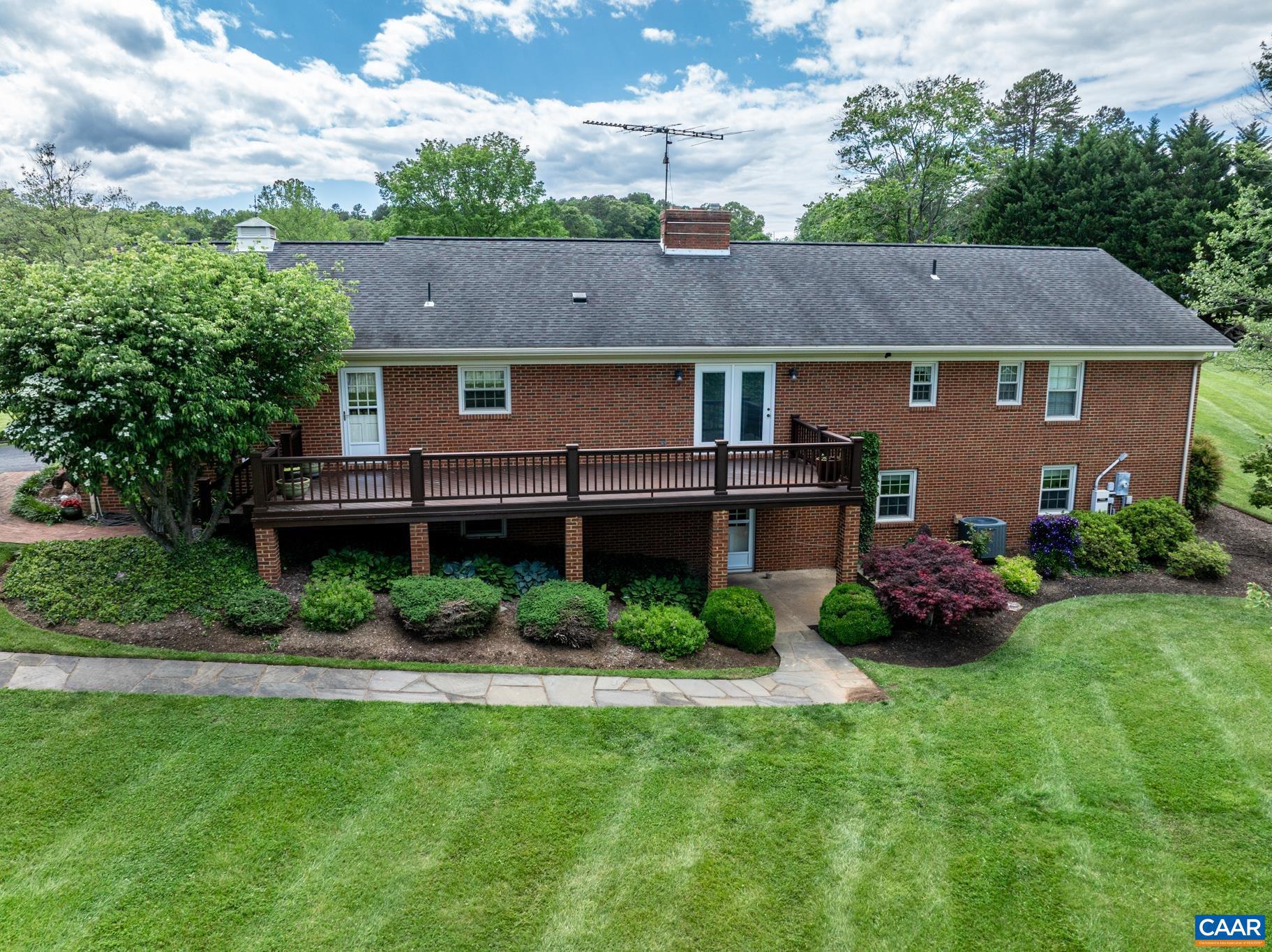 4330 Ridge Road Barboursville, VA 22923 - Photo 2 of 19 a front view of a house with a garden