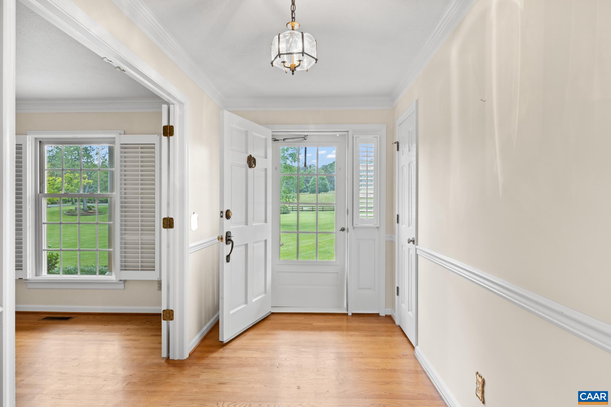 4330 Ridge Road Barboursville, VA 22923 - Photo 4 of 19 a view of an entryway with wooden floor and door