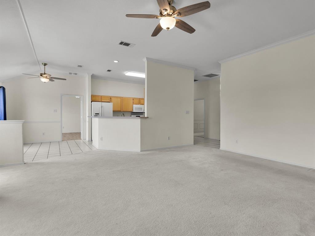 10832 Sky Ridge Court Haslet, TX 76052 - Photo 11 of 40 a view of a livingroom with a ceiling fan and window