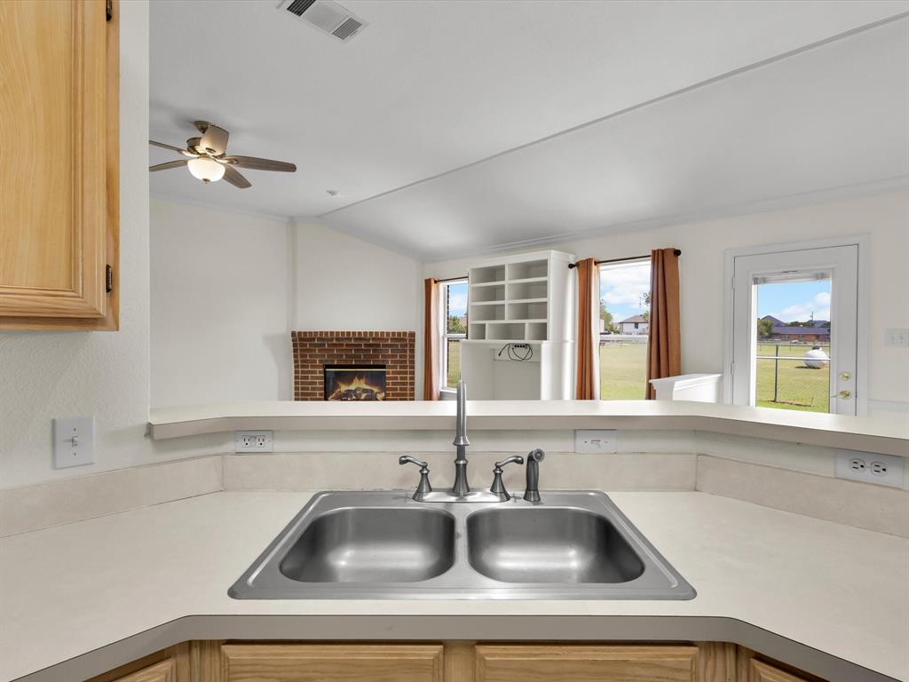10832 Sky Ridge Court Haslet, TX 76052 - Photo 20 of 40 a kitchen with a sink and a window
