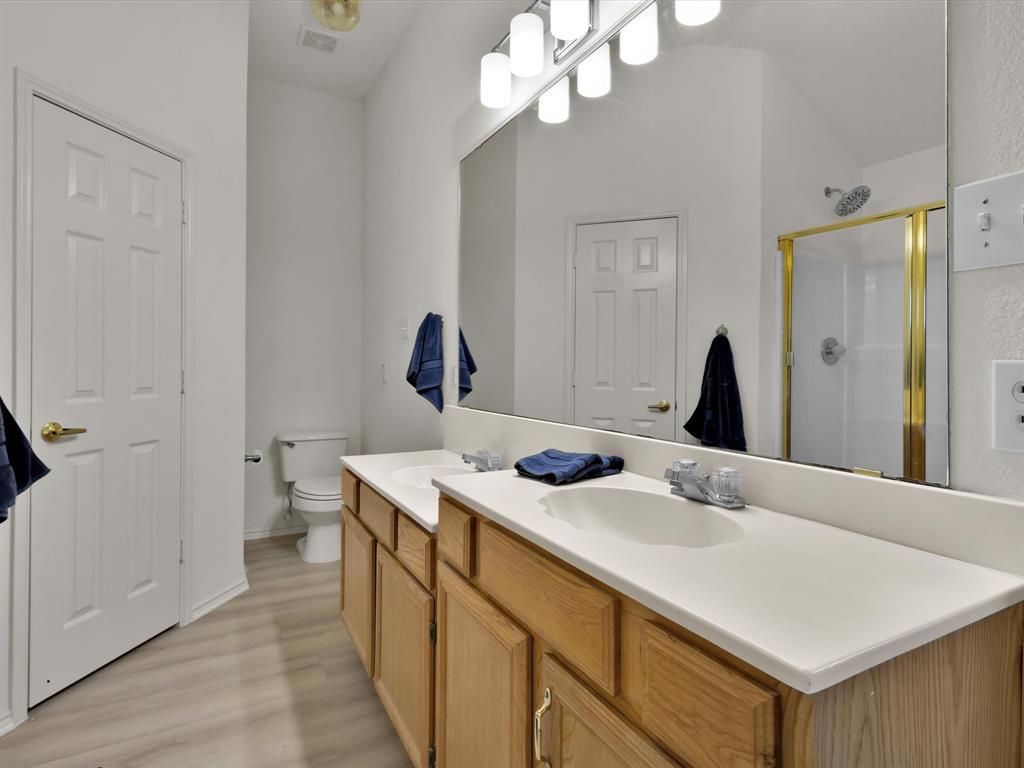 10832 Sky Ridge Court Haslet, TX 76052 - Photo 26 of 40 a en suite bathroom with a sink and a mirror
