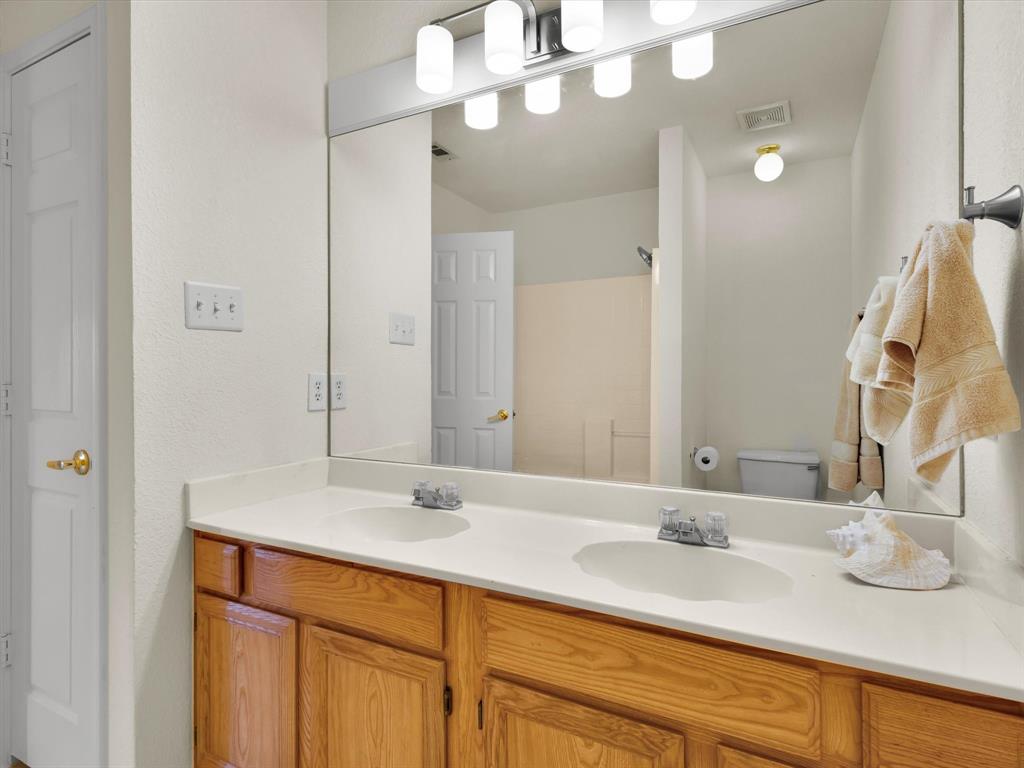 10832 Sky Ridge Court Haslet, TX 76052 - Photo 31 of 40 a bathroom with a sink and a mirror