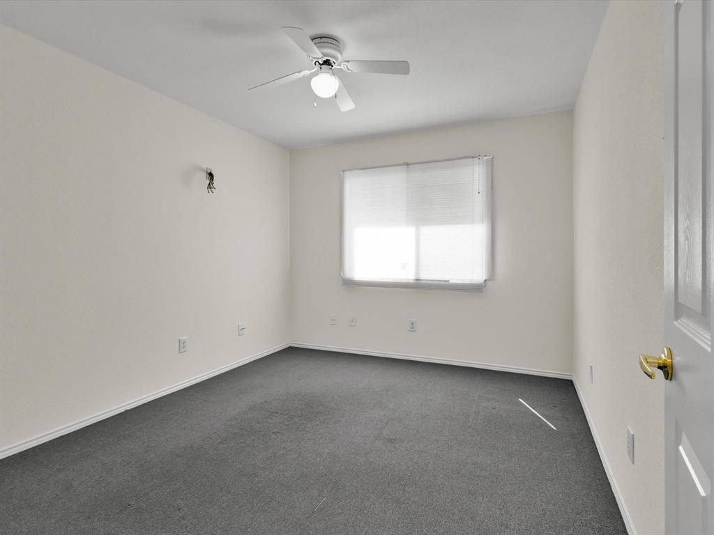 10832 Sky Ridge Court Haslet, TX 76052 - Photo 38 of 40 an empty room with a window and a ceiling fan