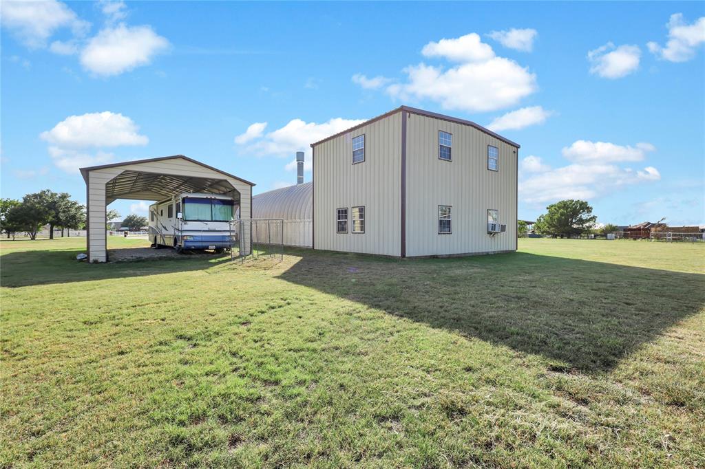 10832 Sky Ridge Court Haslet, TX 76052 - Photo 4 of 40 a front view of a house with a yard