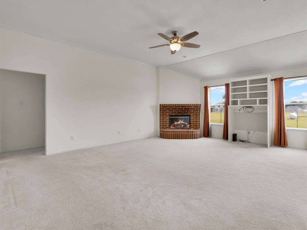10832 Sky Ridge Court Haslet, TX 76052 - Photo 10 of 40 a view of empty room with a fireplace
