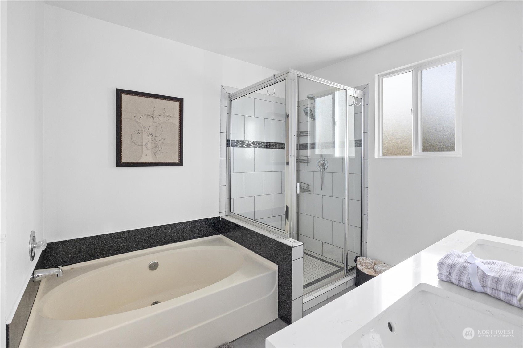 513 211th Place Southeast Bothell, WA 98021 - Photo 27 of 39 a bathroom with a bathtub and a shower