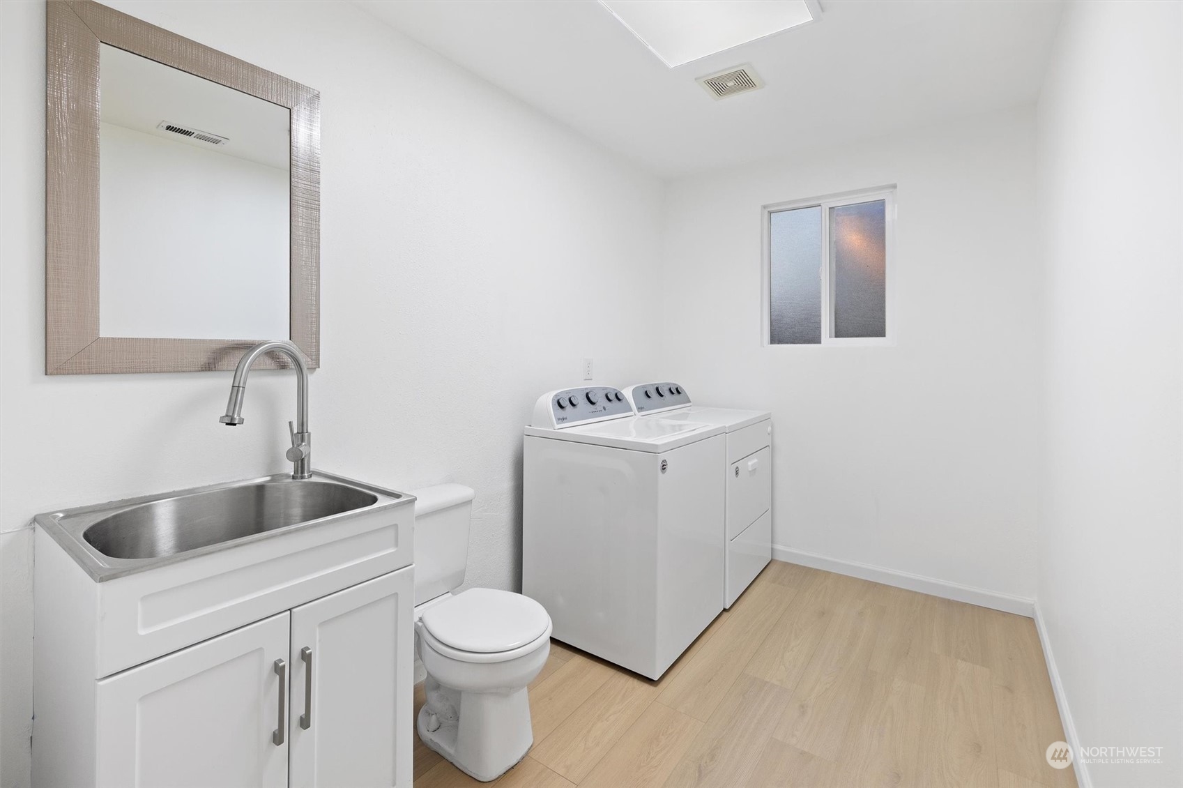 513 211th Place Southeast Bothell, WA 98021 - Photo 29 of 39 a bathroom with a toilet sink and mirror