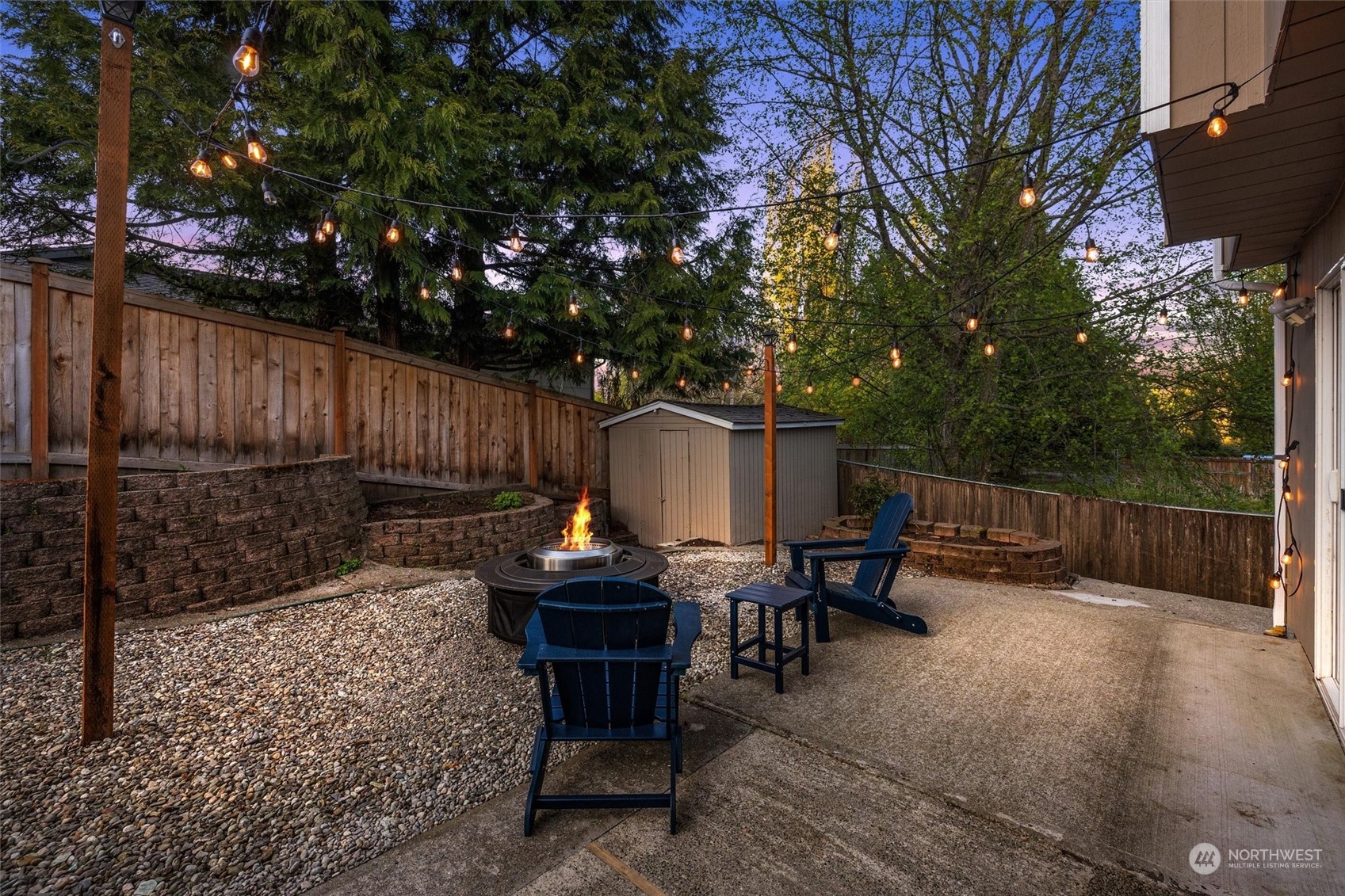 513 211th Place Southeast Bothell, WA 98021 - Photo 33 of 39 a view of backyard with seating space and wooden fence