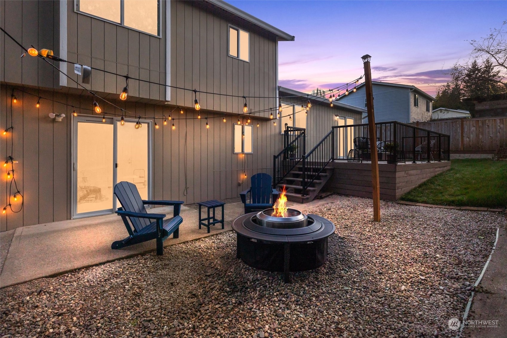 513 211th Place Southeast Bothell, WA 98021 - Photo 34 of 39 a view of a chairs and fire pit in the backyard