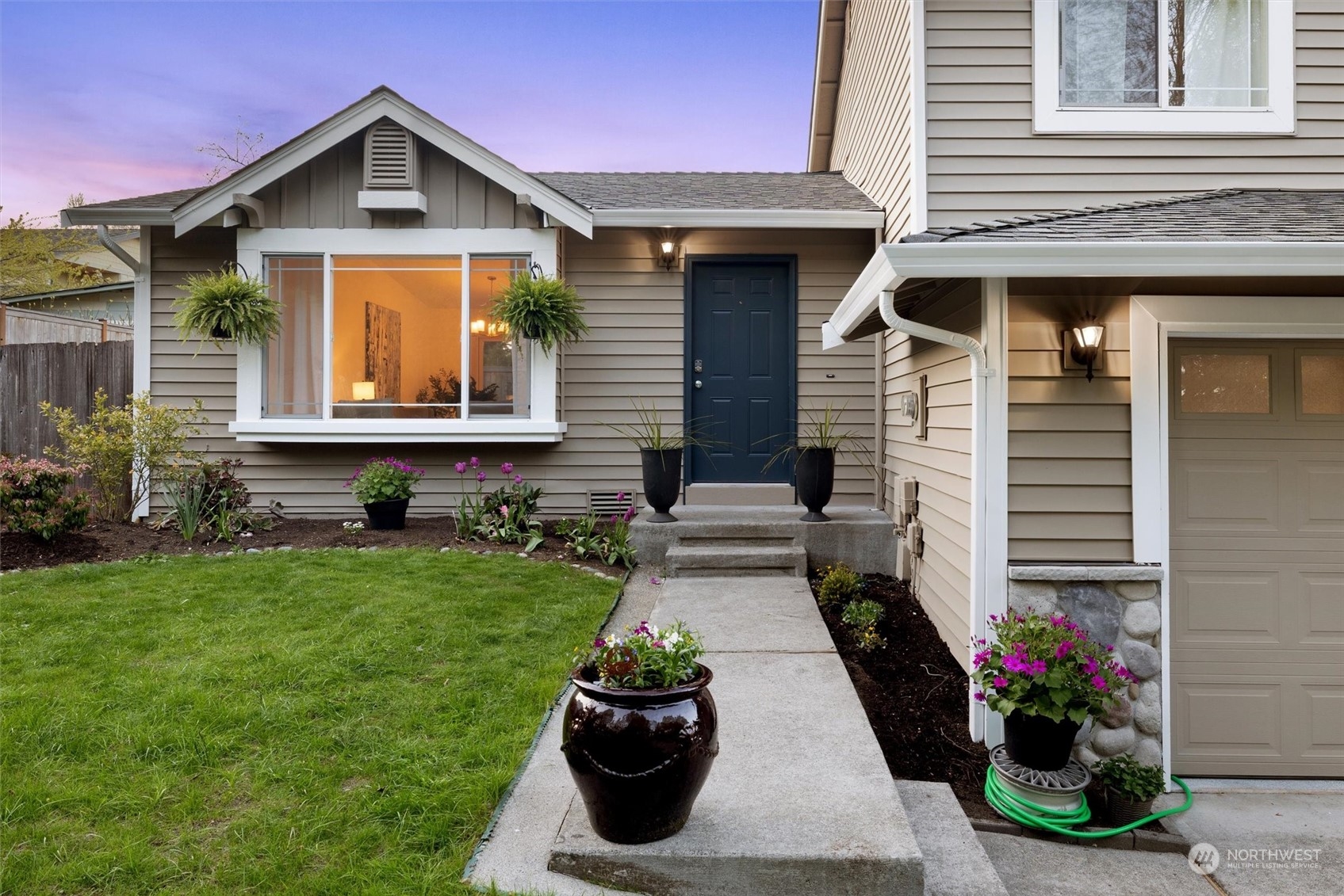 513 211th Place Southeast Bothell, WA 98021 - Photo 5 of 39 a front view of a house with a yard