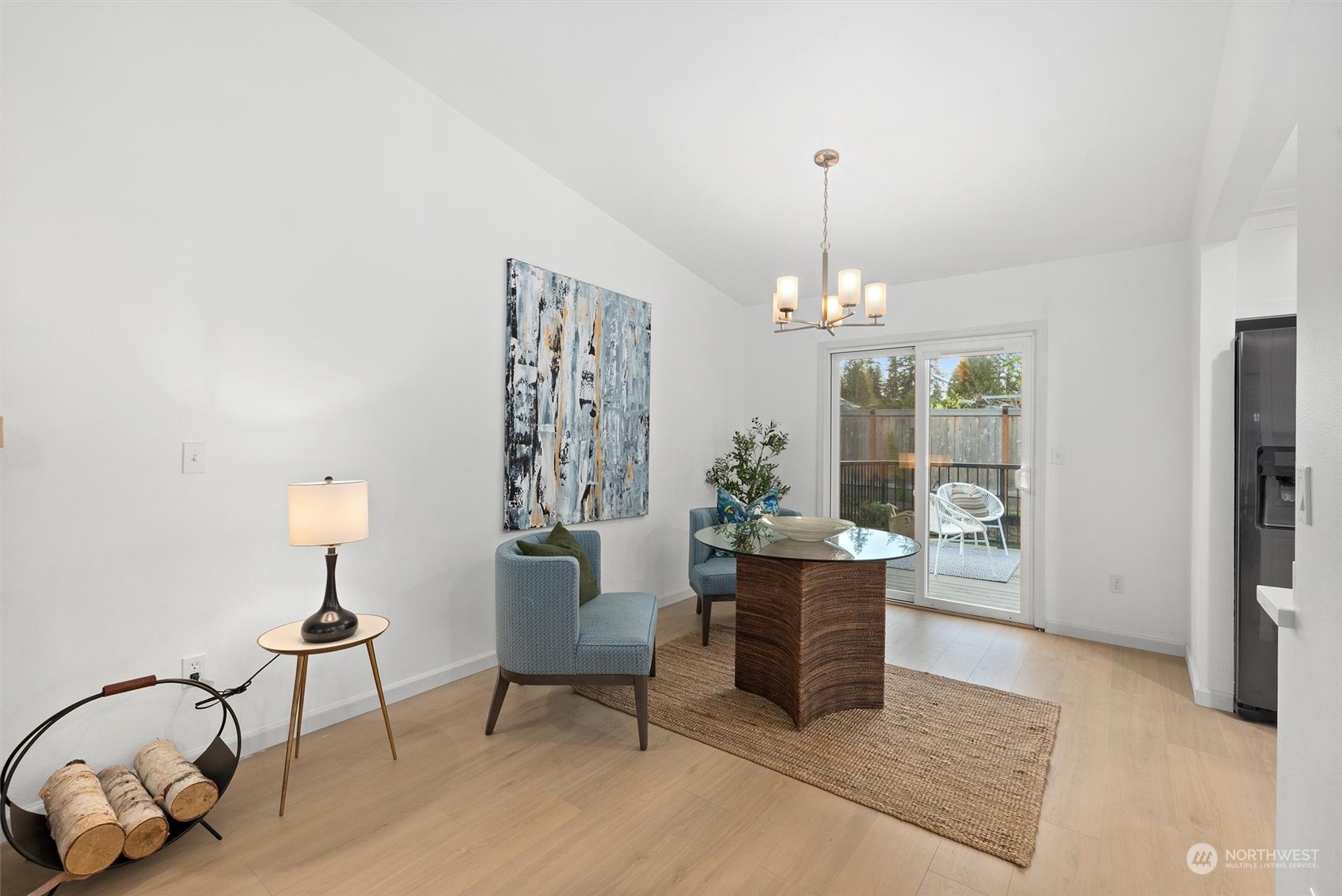 513 211th Place Southeast Bothell, WA 98021 - Photo 10 of 39 a living room with furniture and a chandelier
